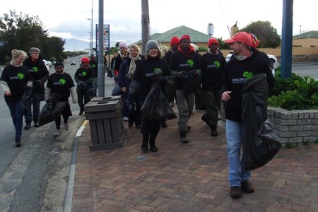 Staff members of the Grootbos Foundation on their way to the Municipal Offices while picking up litter